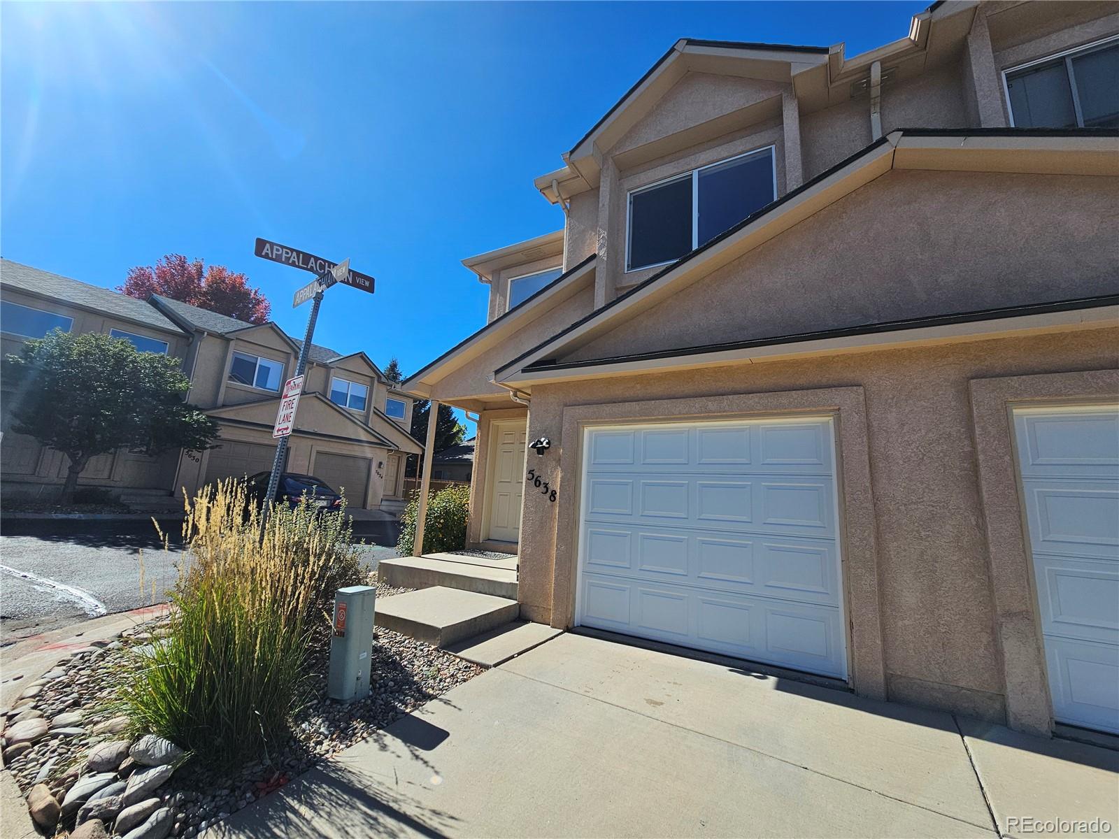 5638 Appalachian View Colorado Springs, CO 80918 - Photo 2 of 21 a front view of a house with garden