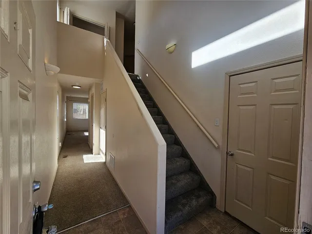 a view of a hallway with staircase