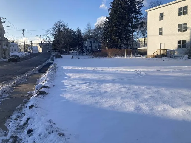 a view of a yard with a ocean view