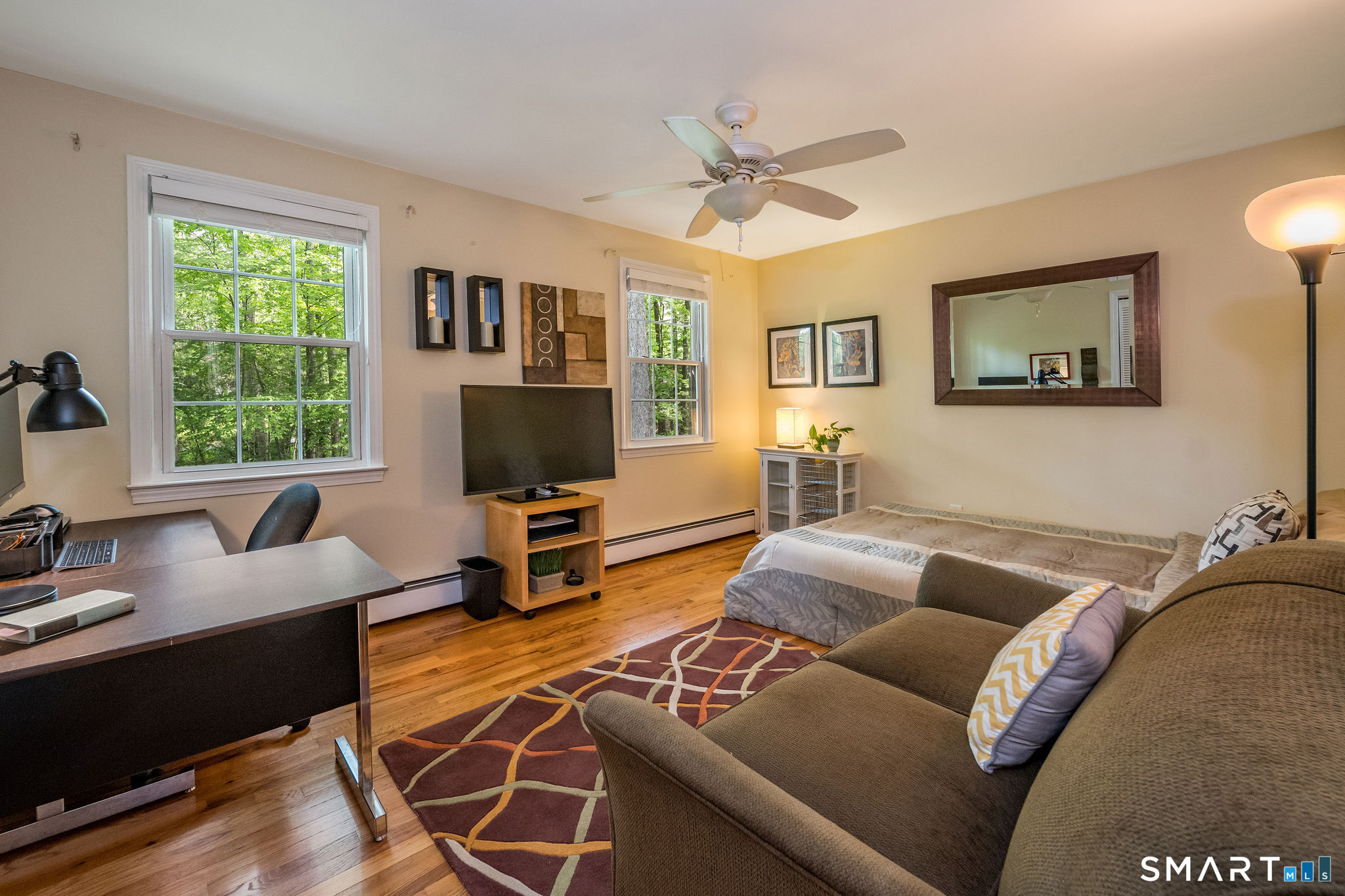 60 Bradley Corners Road Madison, CT 06443 - Photo 24 of 33 a living room with furniture and a flat screen tv