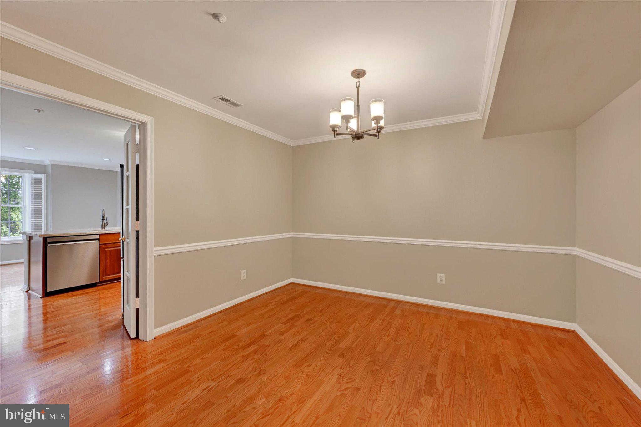 12310 Rosslare Ridge Road, Unit 405 Lutherville-Timonium, MD 21093 - Photo 9 of 36 Elegant space with warm wood floors.