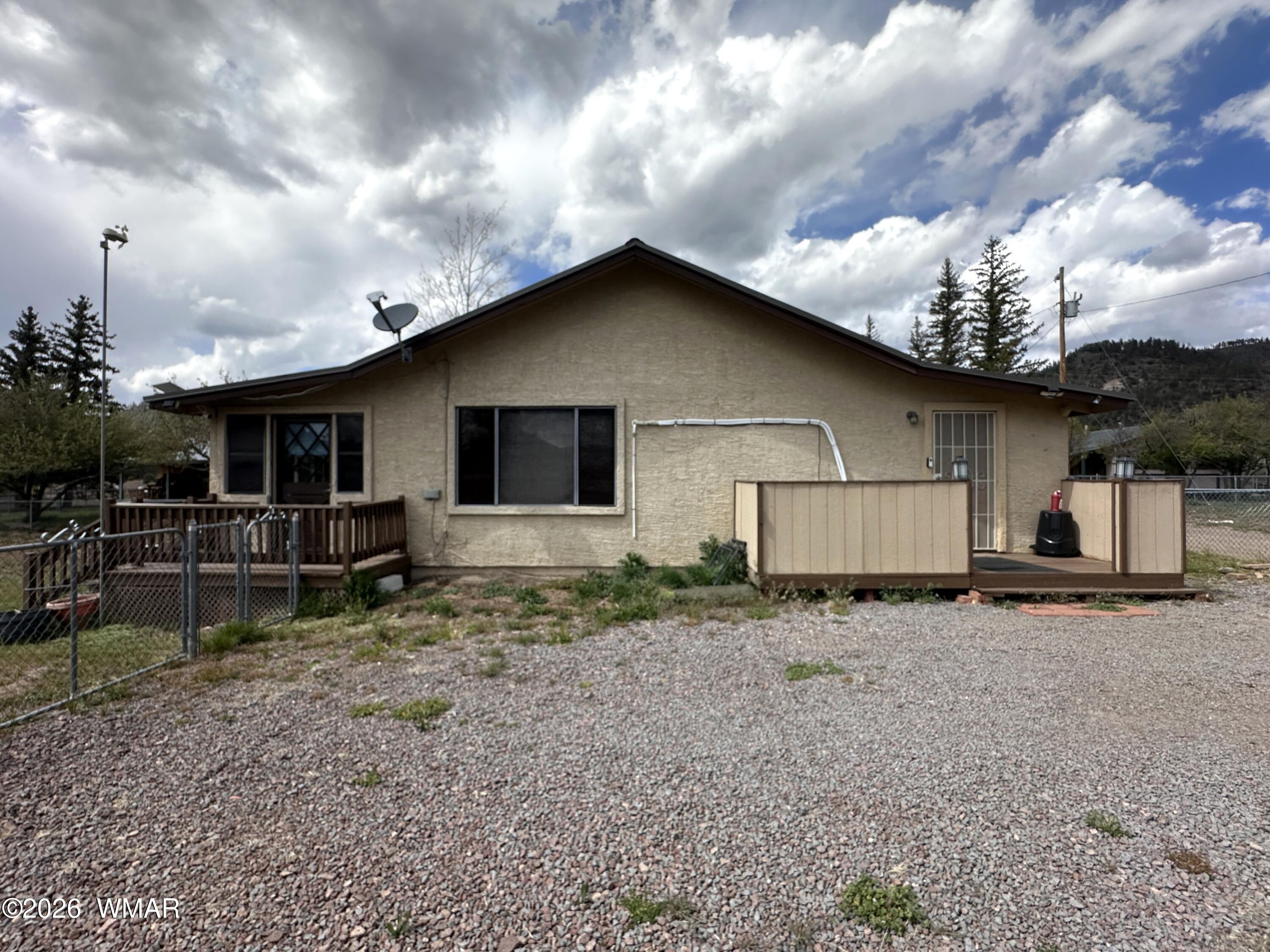 19 County Road Alpine, AZ 85920 - Photo 21 of 27 a view of a house with backyard and sitting area