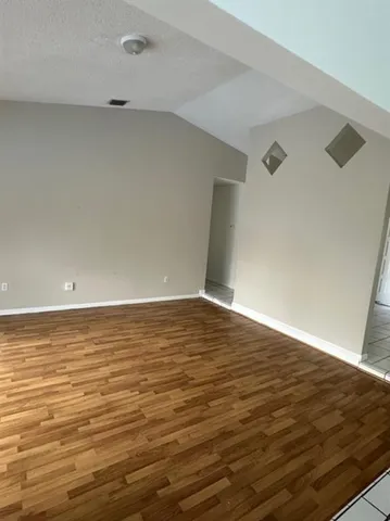 a view of an empty room and window