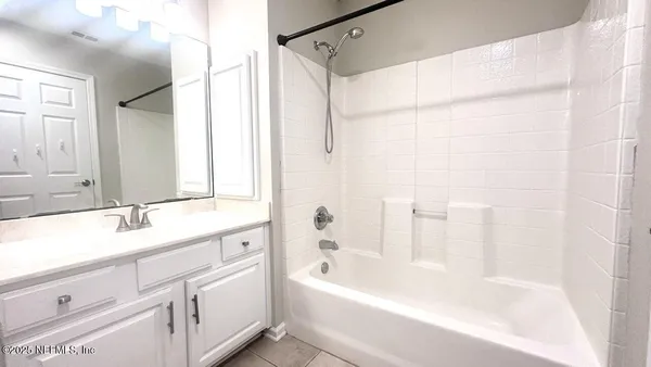 a bathroom with a bathtub and a sink