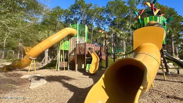 a view of a chairs and table in patio