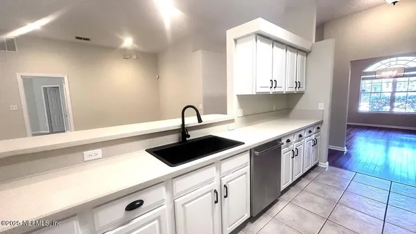 a kitchen with a sink and cabinets