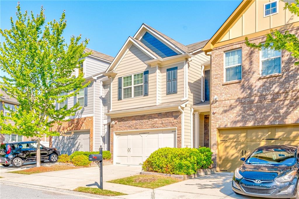 2310 Elmbridge Road Buford, GA 30519 - Photo 1 of 1 a front view of a house with a yard