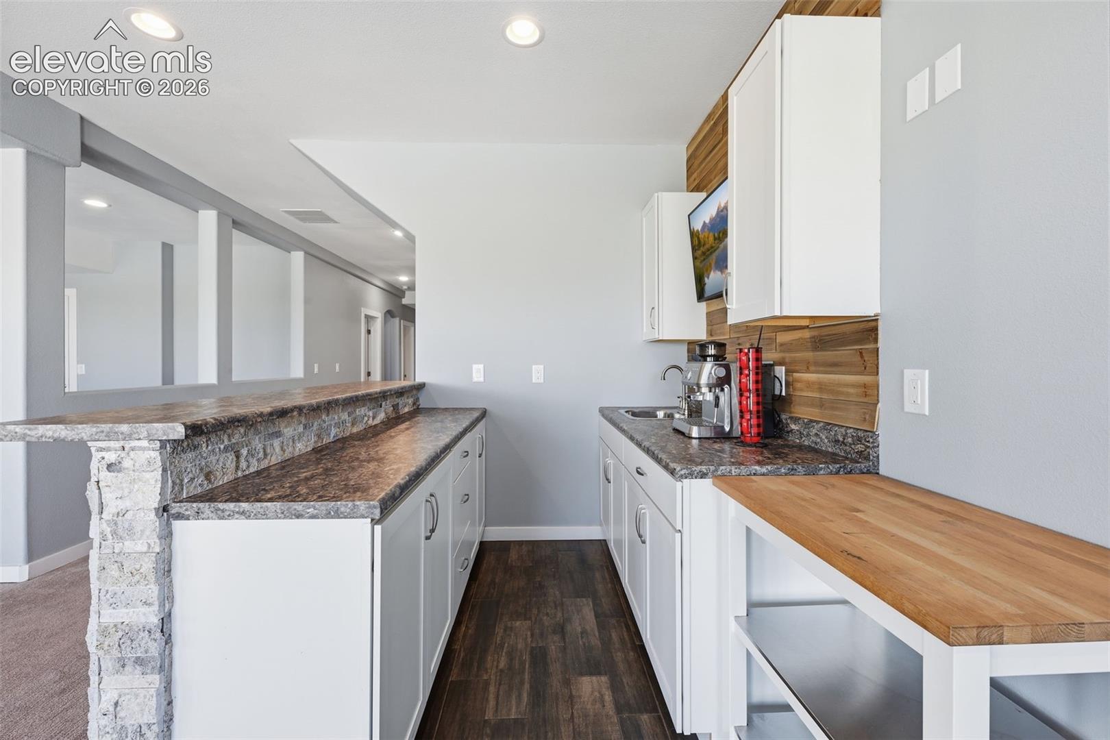 23335 Sanborn Road Calhan, CO 80808 - Photo 19 of 28 Basement wet bar with additional prep and entertaining space