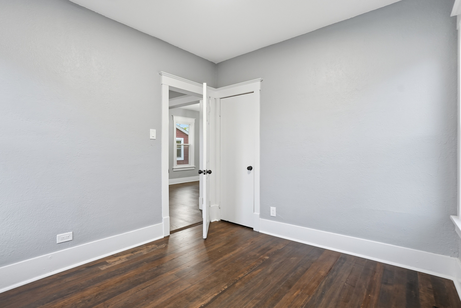 446 South Jackson Street Waukegan, IL 60085 - Photo 11 of 20 a view of an empty room with wooden floor