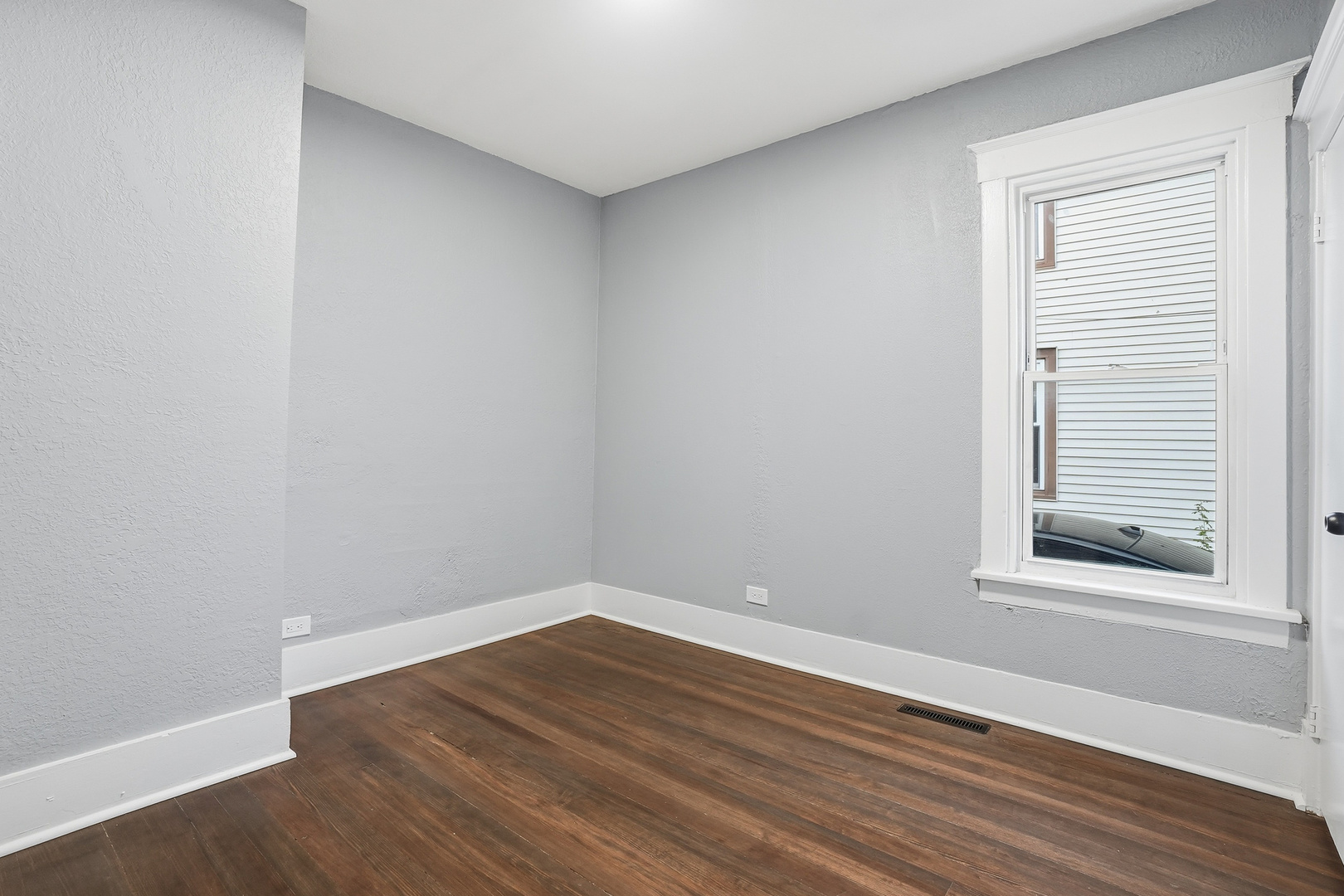 446 South Jackson Street Waukegan, IL 60085 - Photo 12 of 20 a view of a room that has wooden floor and a window