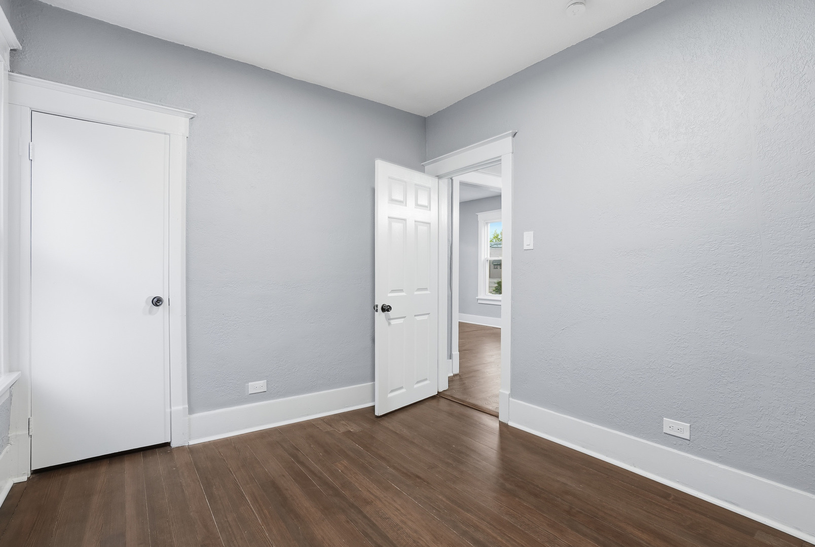 446 South Jackson Street Waukegan, IL 60085 - Photo 13 of 20 a view of an empty room with wooden floor and closet
