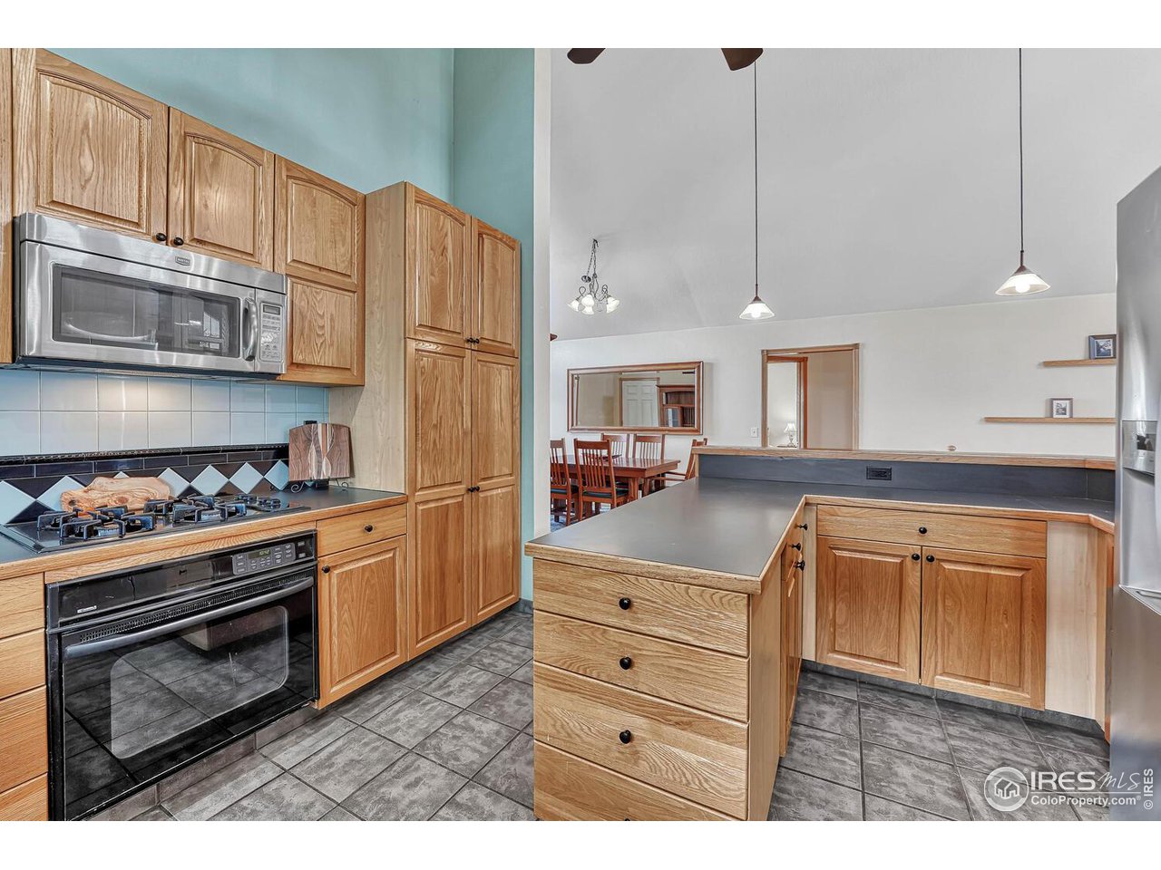 2608 Pleasant Valley Road Fort Collins, CO 80521 - Photo 11 of 40 Kitchen island that swings to the interior of the kitchen provides so much extra counter top space.