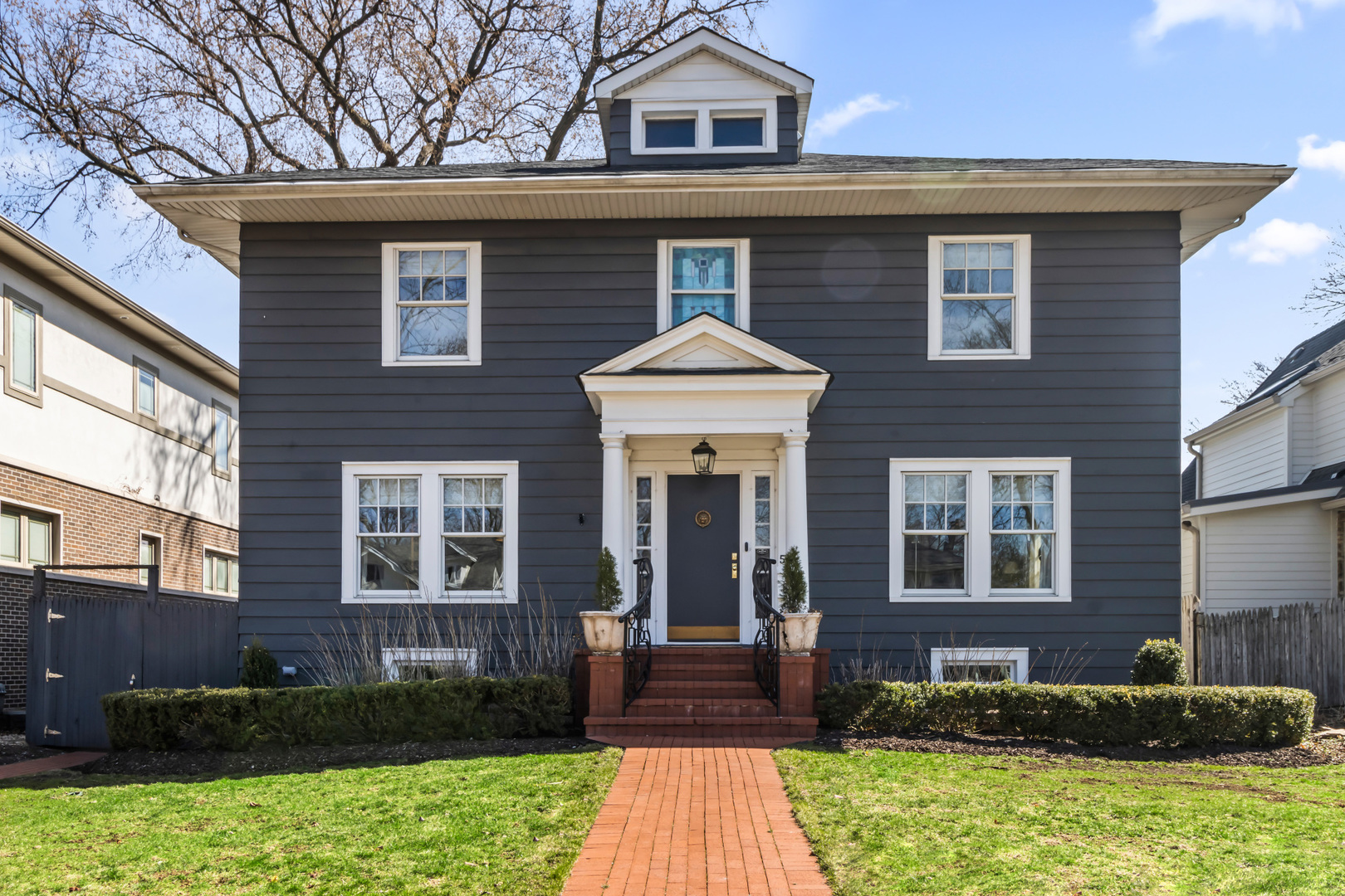 a front view of a house with a yard