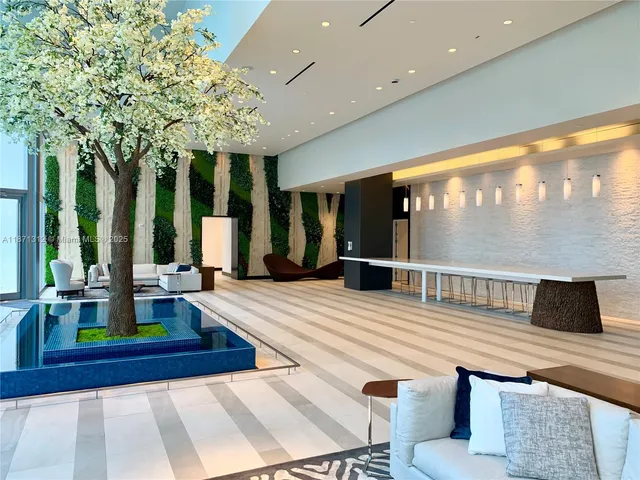 a view of a swimming pool with a table and chairs
