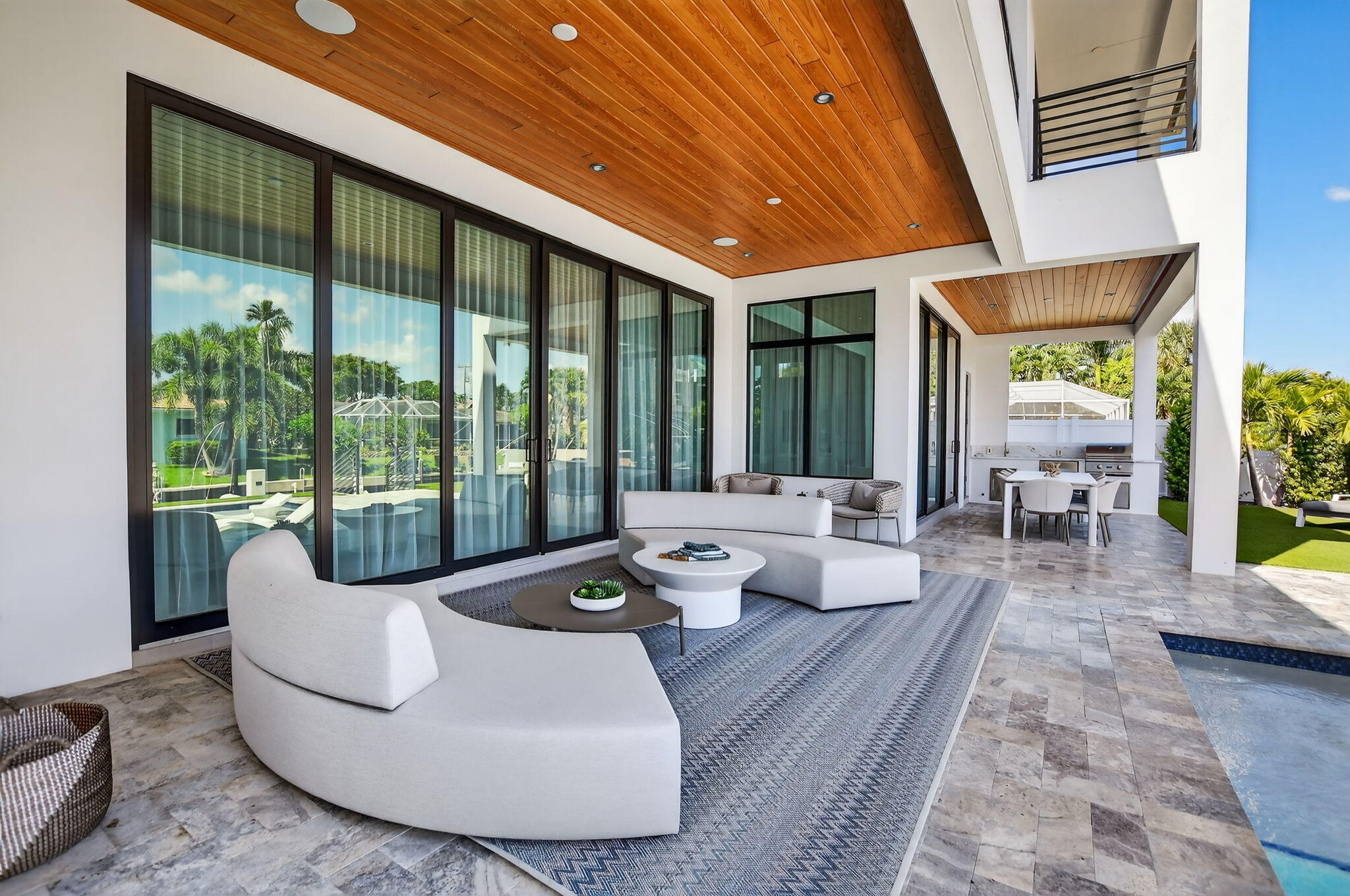725 Northeast 71st Street Boca Raton, FL 33487 - Photo 53 of 66 a living room with furniture and a floor to ceiling window