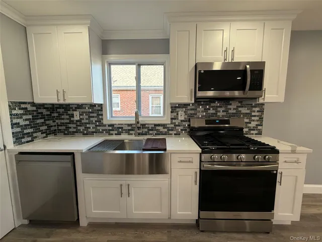 a kitchen with a stove and a sink