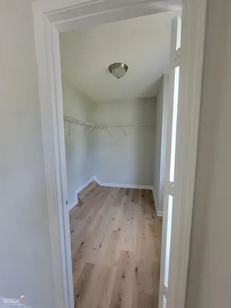 an empty room with wooden floor