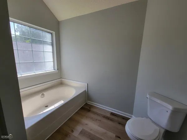 a bathroom with a sink toilet and bathtub