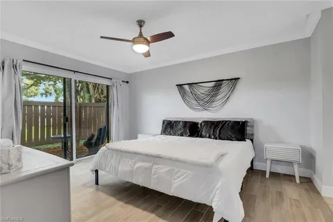 a bedroom with a bed and a table