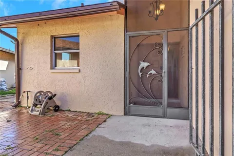 a view of a door and chair in the room