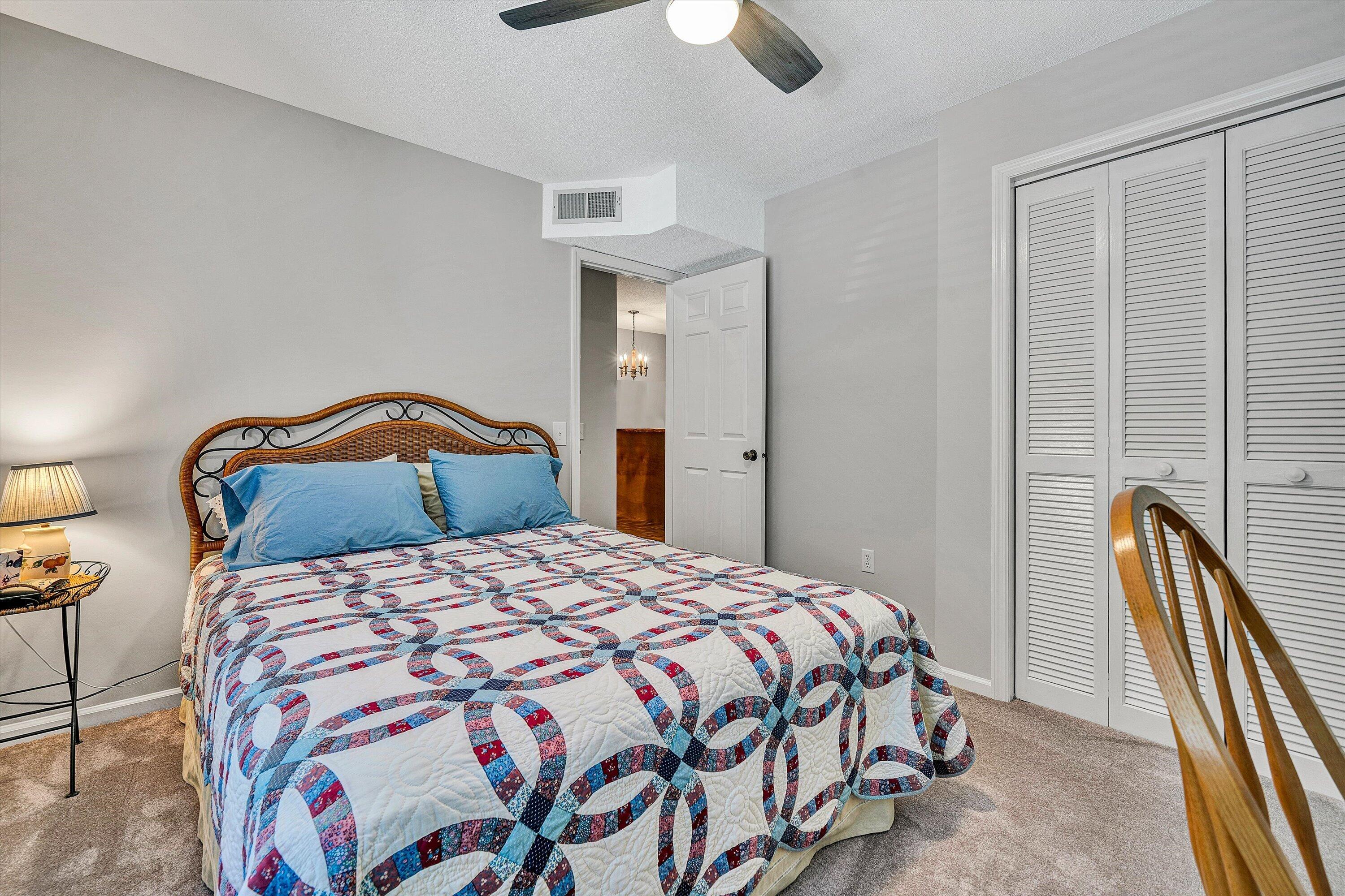 620 Monte Vista Road, Unit 605 Union Hall, VA 24176 - Photo 21 of 41 a bedroom with a bed and a chandelier