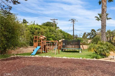 a blue couch sitting in a living room next to a lamp