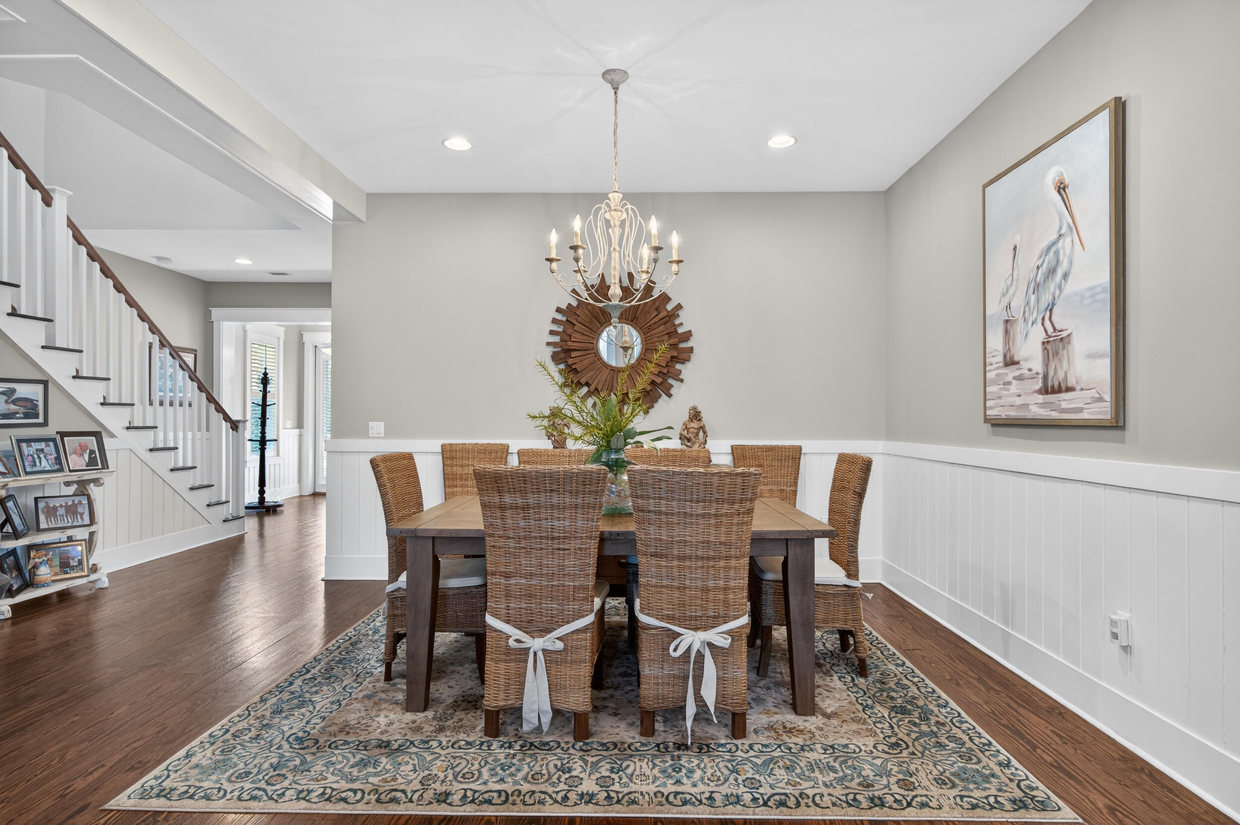 563 Sandgrass Boulevard Santa Rosa Beach, FL 32459 - Photo 11 of 73 a view of a dining room with furniture wooden floor and chandelier