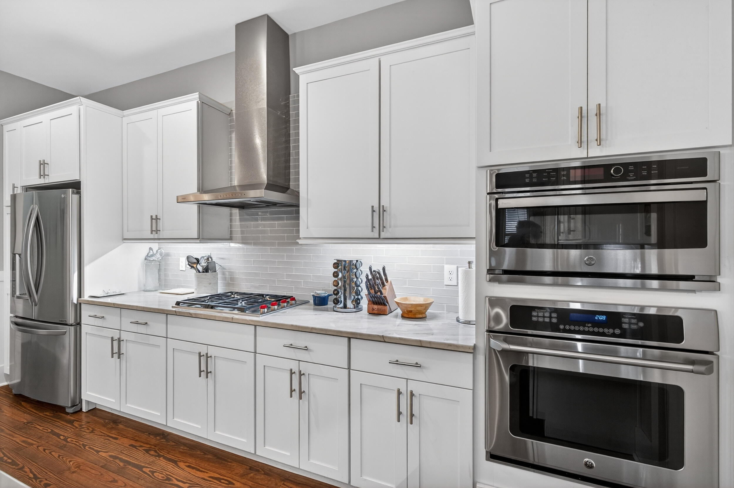 563 Sandgrass Boulevard Santa Rosa Beach, FL 32459 - Photo 17 of 73 a kitchen with cabinets stainless steel appliances and sink