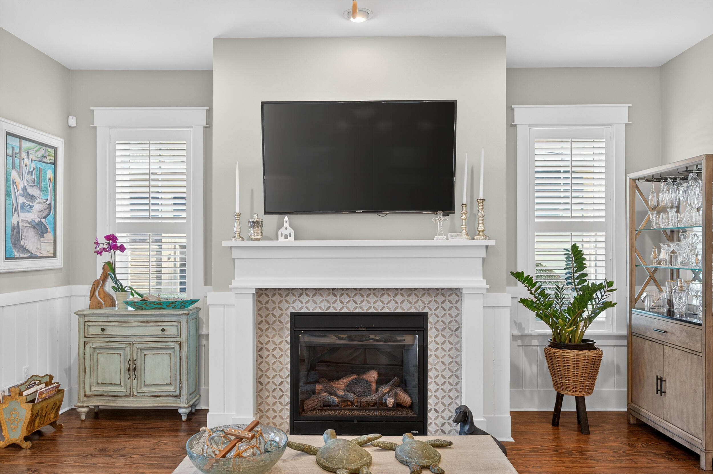 563 Sandgrass Boulevard Santa Rosa Beach, FL 32459 - Photo 19 of 73 a living room with furniture a flat screen tv and a fireplace