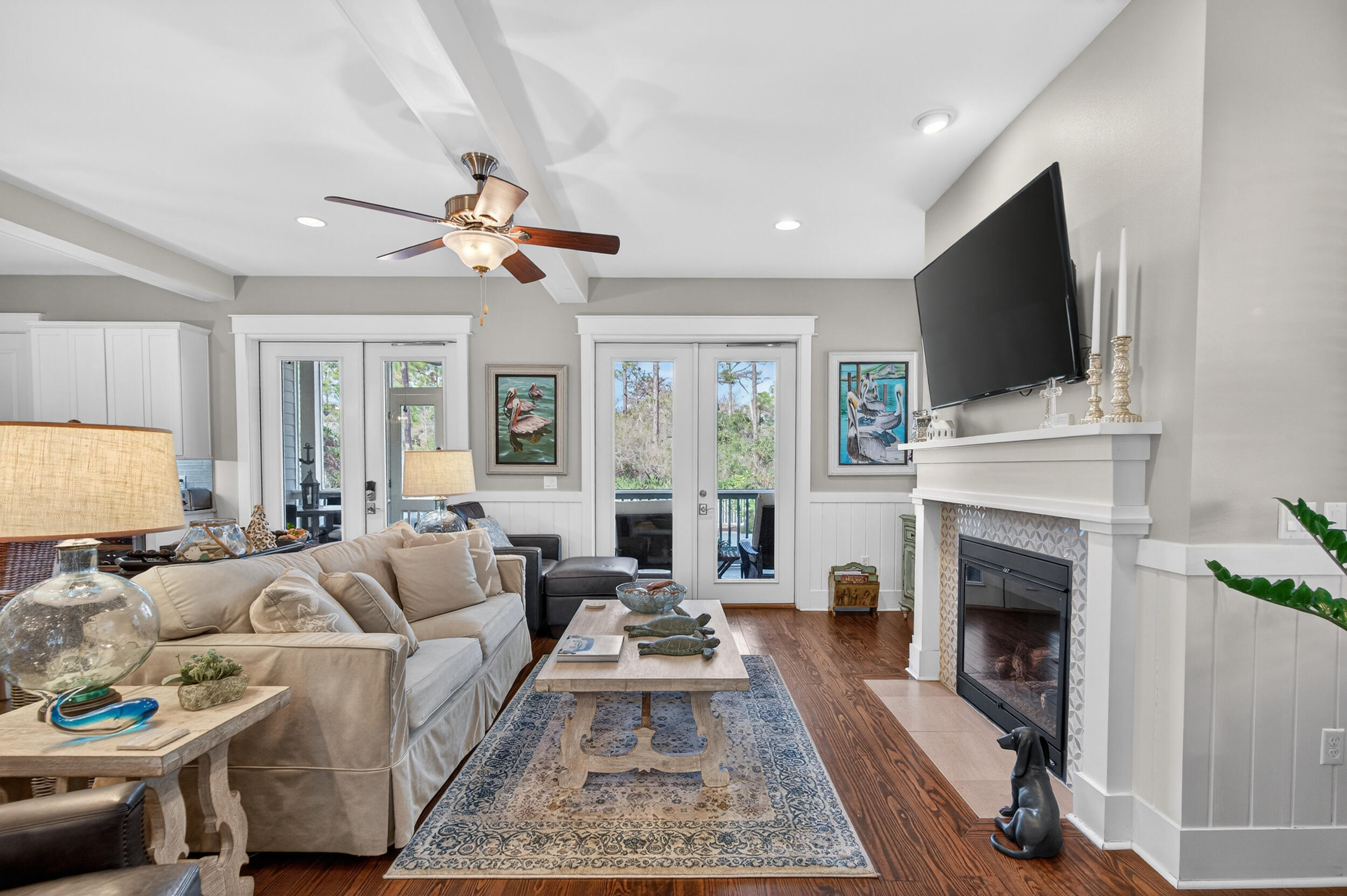 563 Sandgrass Boulevard Santa Rosa Beach, FL 32459 - Photo 20 of 73 a living room with furniture a fireplace and a flat screen tv