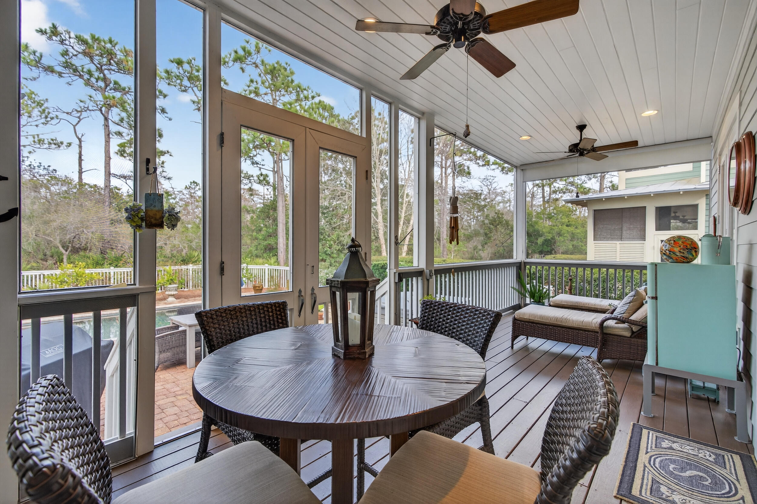 563 Sandgrass Boulevard Santa Rosa Beach, FL 32459 - Photo 24 of 73 a view of a dining room with furniture large windows and wooden floor