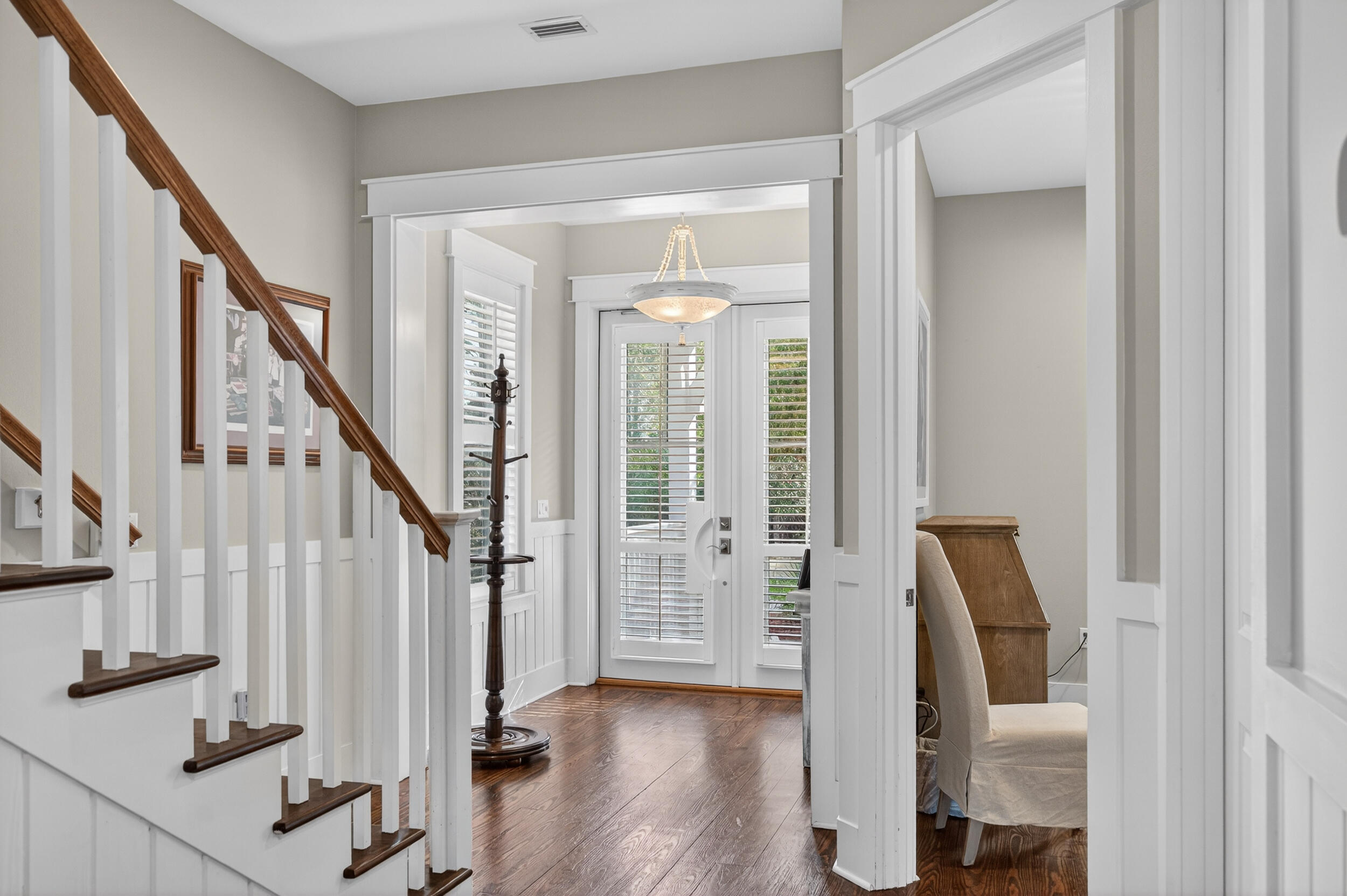 563 Sandgrass Boulevard Santa Rosa Beach, FL 32459 - Photo 27 of 73 a view of an entryway with wooden floor and door