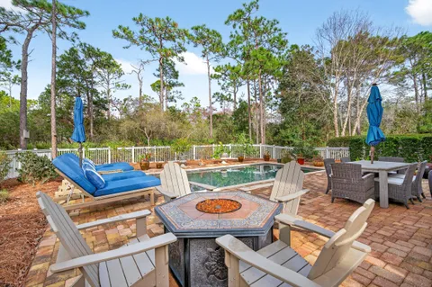 a view of a house with backyard porch and sitting area