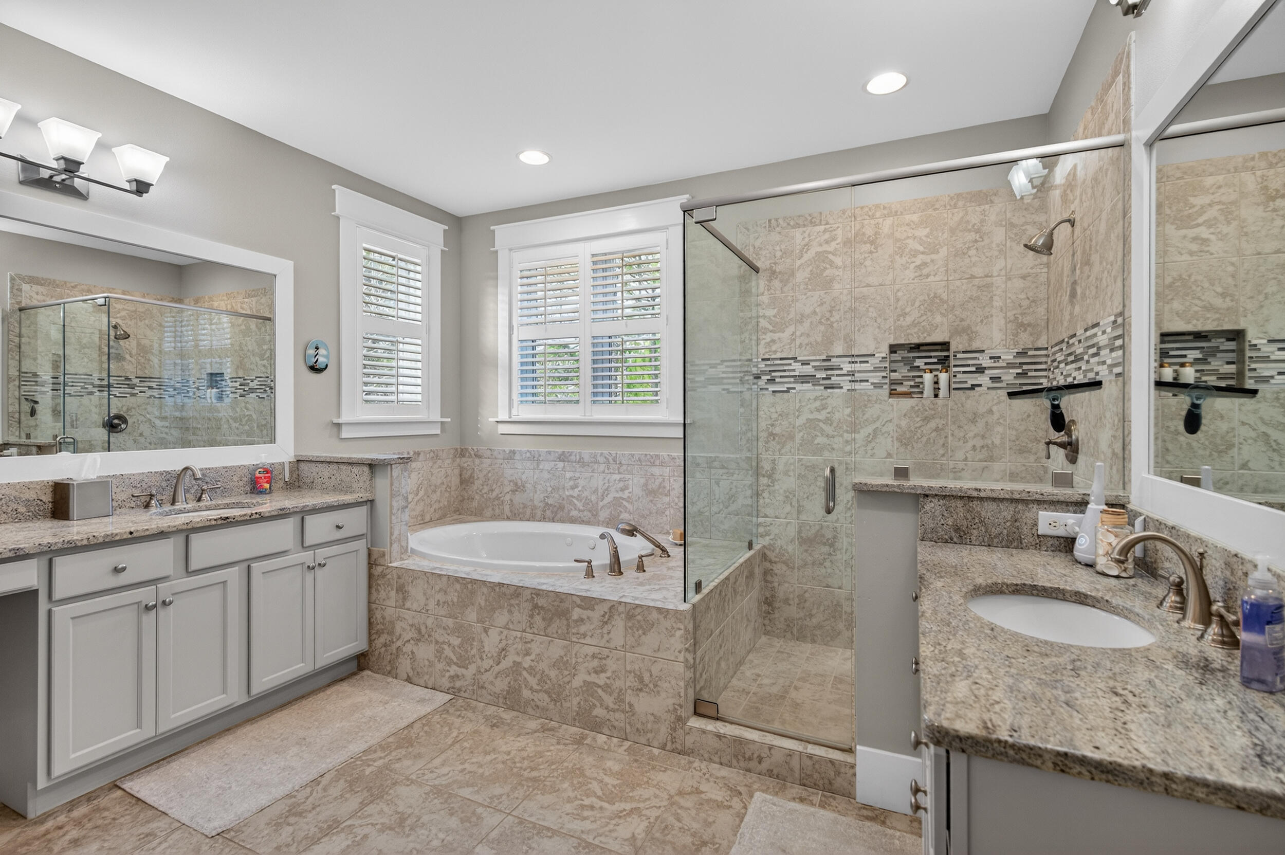 563 Sandgrass Boulevard Santa Rosa Beach, FL 32459 - Photo 35 of 73 a bathroom with a granite countertop tub sink and mirror