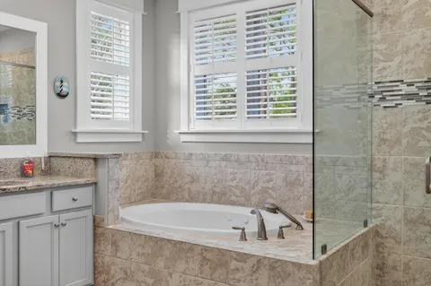 a bathroom with a toilet and a bathtub