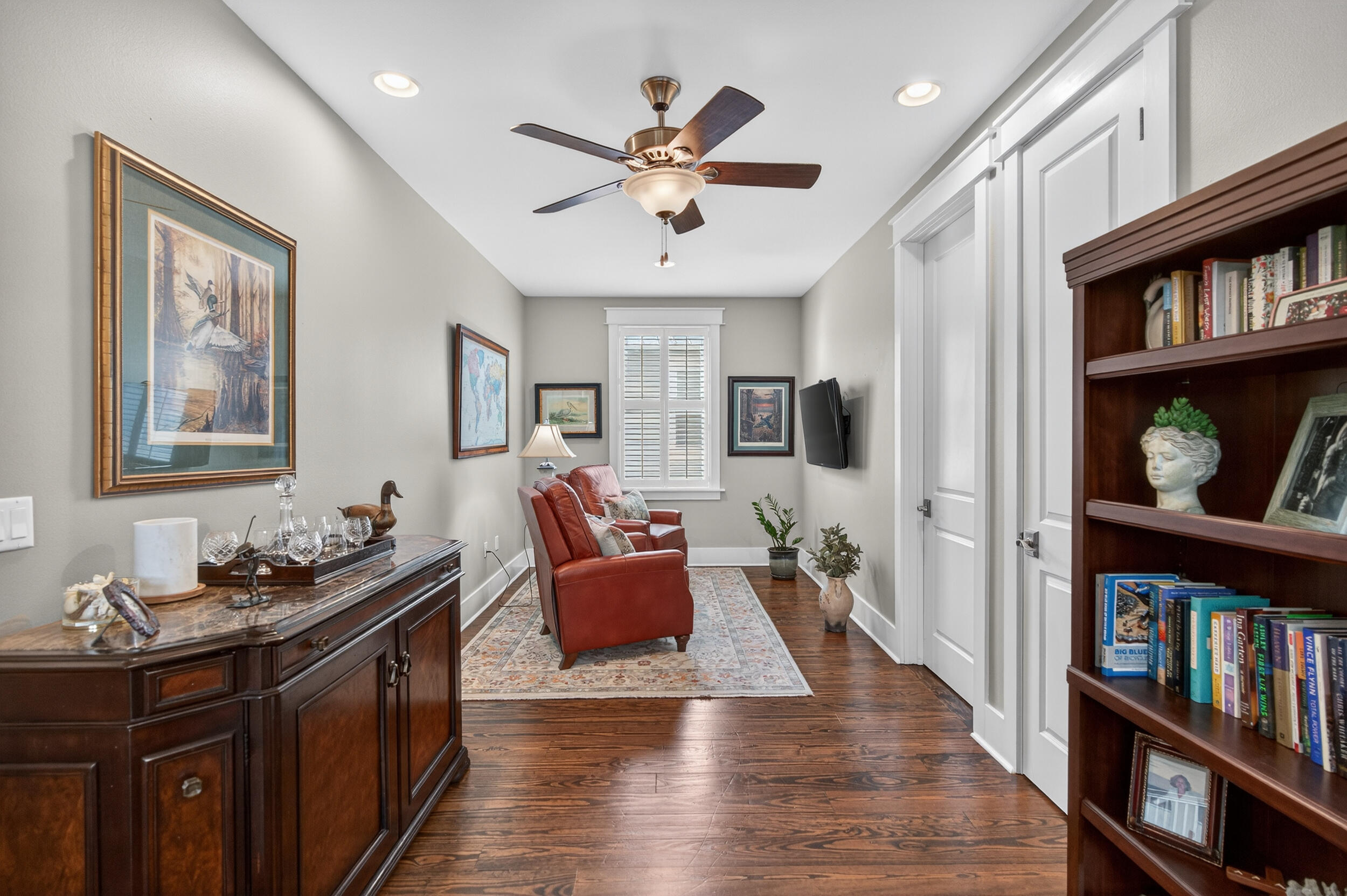 563 Sandgrass Boulevard Santa Rosa Beach, FL 32459 - Photo 38 of 73 a living room with furniture and book shelf