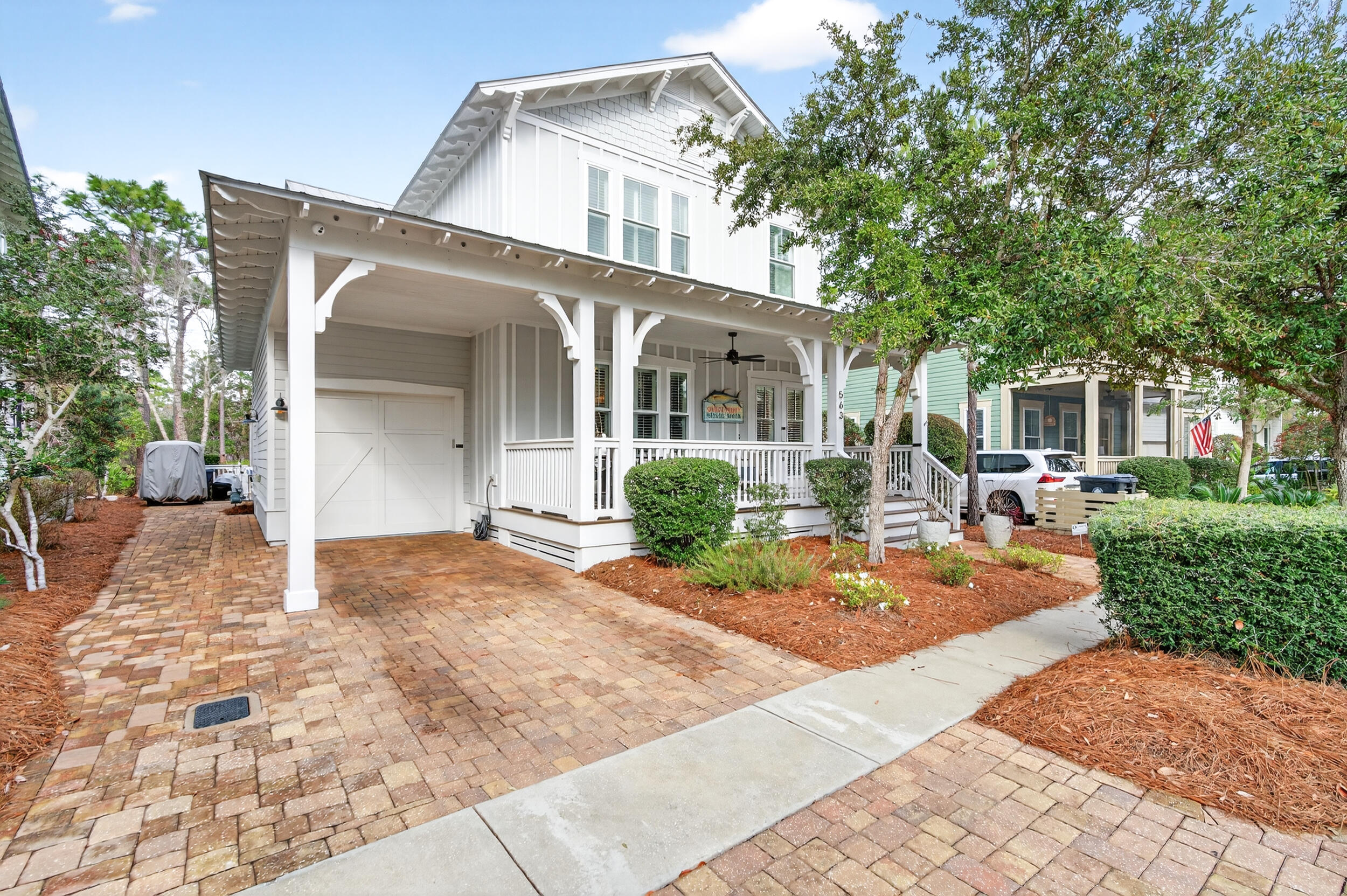 563 Sandgrass Boulevard Santa Rosa Beach, FL 32459 - Photo 4 of 73 a view of a house with backyard and sitting area