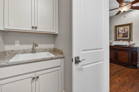 a view of swimming pool with outdoor seating and a house