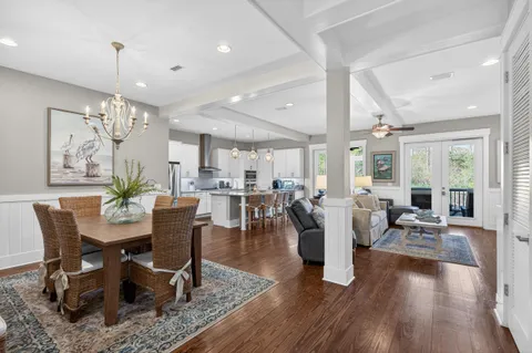 a kitchen with stainless steel appliances granite countertop a sink a stove and cabinets