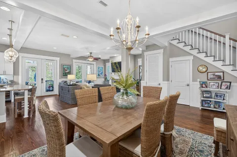 a kitchen with stainless steel appliances granite countertop a stove and a white cabinets