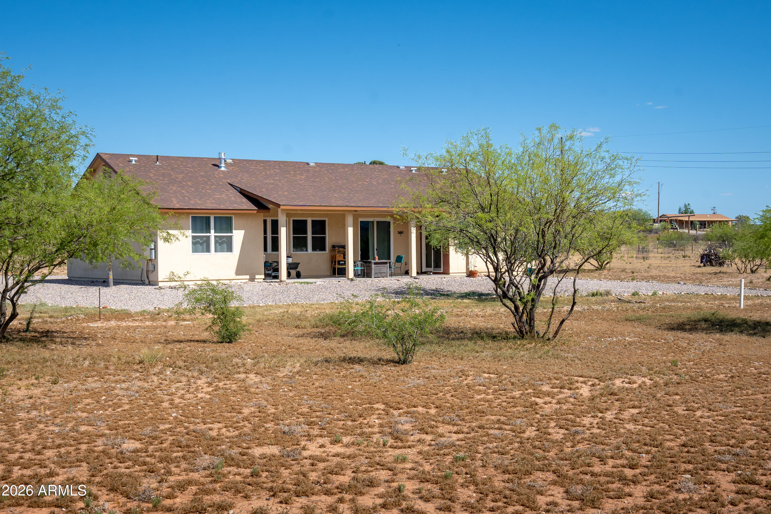 2771 South Country Hill Road Cornville, AZ 86325 - Photo 11 of 48 a front view of a house with a yard