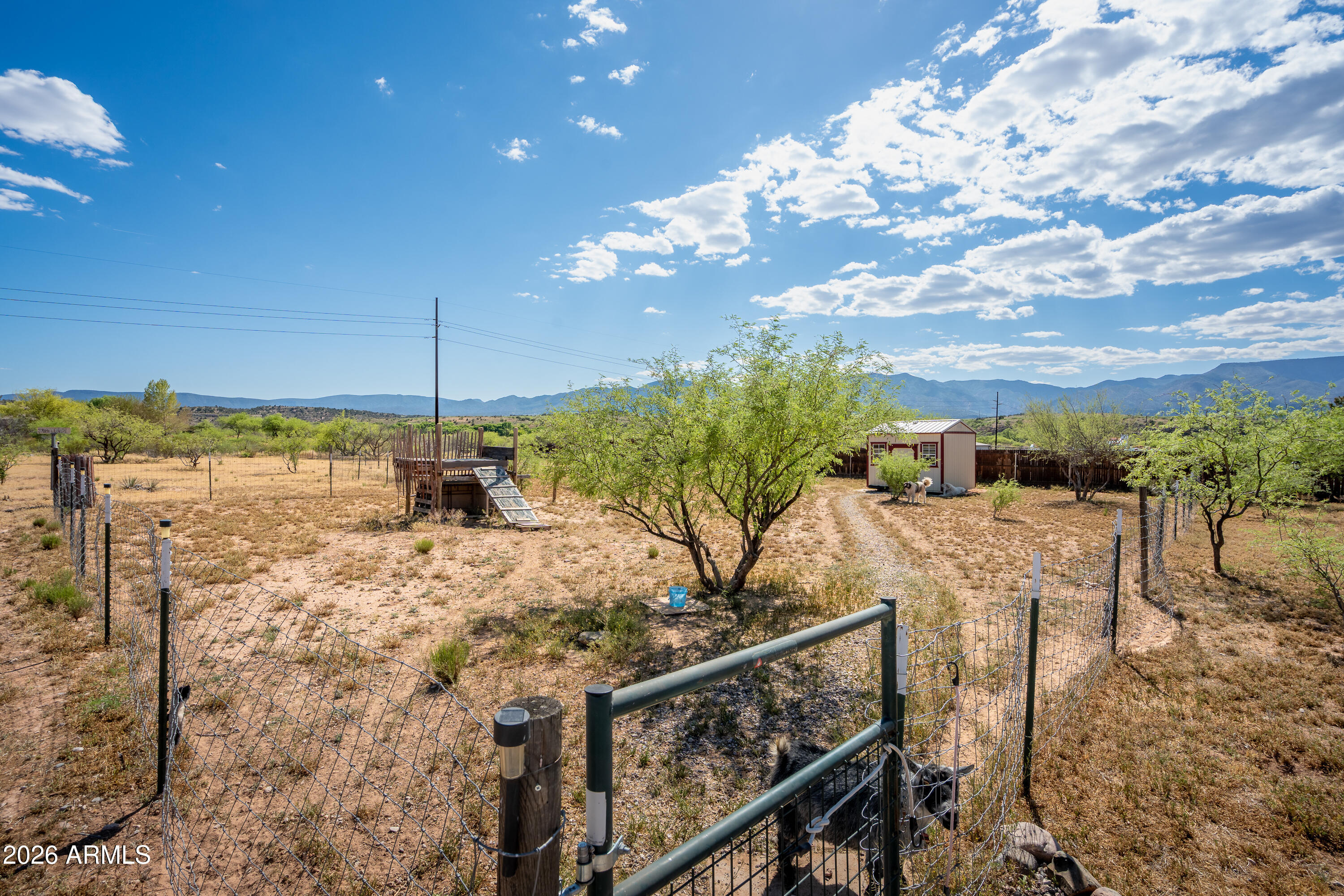 2771 South Country Hill Road Cornville, AZ 86325 - Photo 16 of 48 a view of a balcony with two chairs