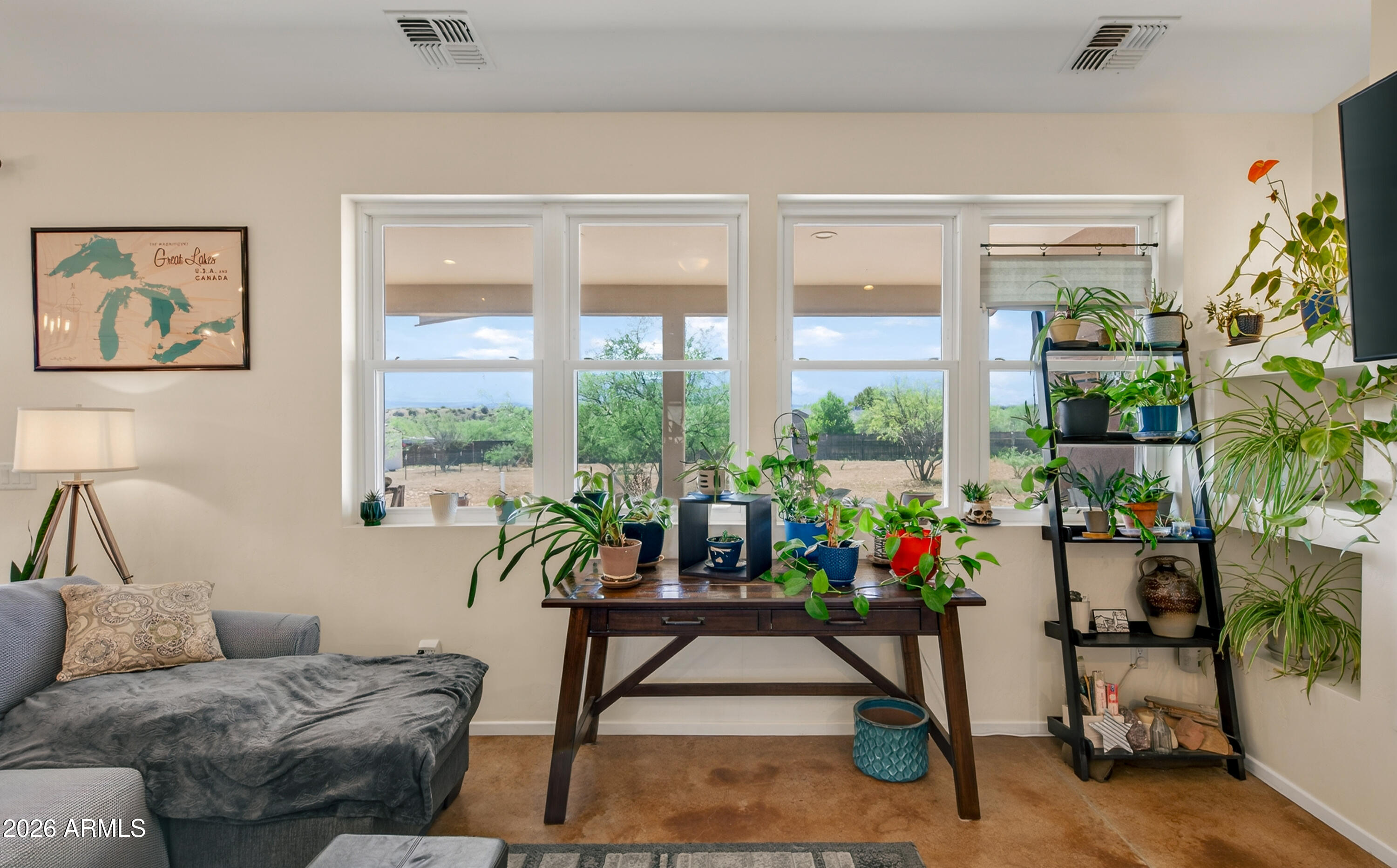 2771 South Country Hill Road Cornville, AZ 86325 - Photo 23 of 48 a living room with furniture and floor to ceiling windows