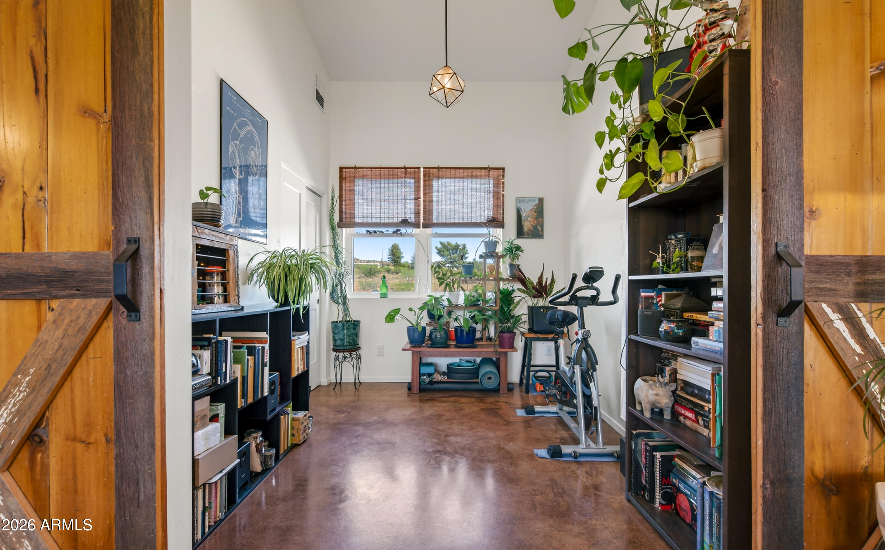 2771 South Country Hill Road Cornville, AZ 86325 - Photo 26 of 48 a view of a hallway with wooden floor and a window