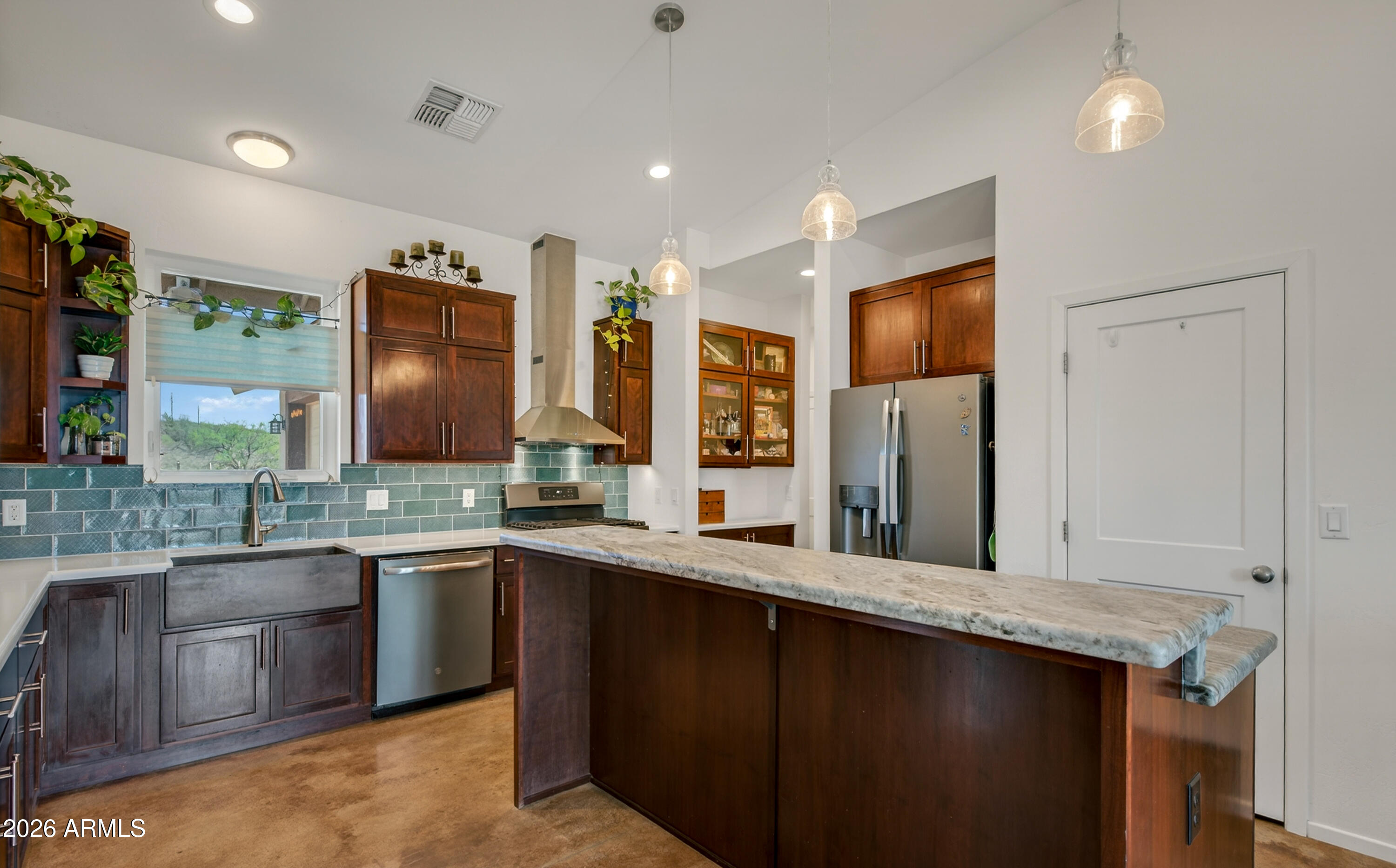 2771 South Country Hill Road Cornville, AZ 86325 - Photo 29 of 48 a large kitchen with a sink and stainless steel appliances