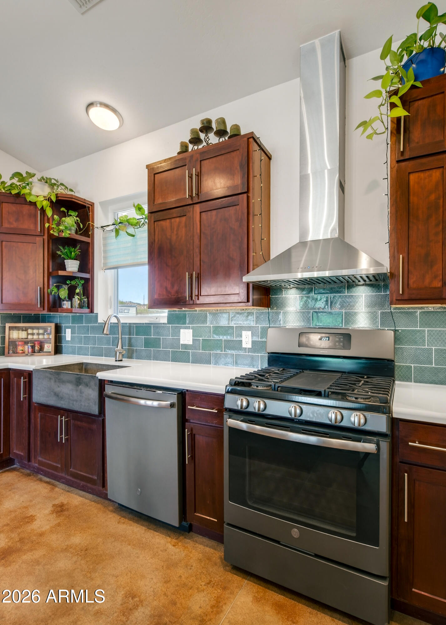 2771 South Country Hill Road Cornville, AZ 86325 - Photo 35 of 48 a kitchen with granite countertop a stove and a sink