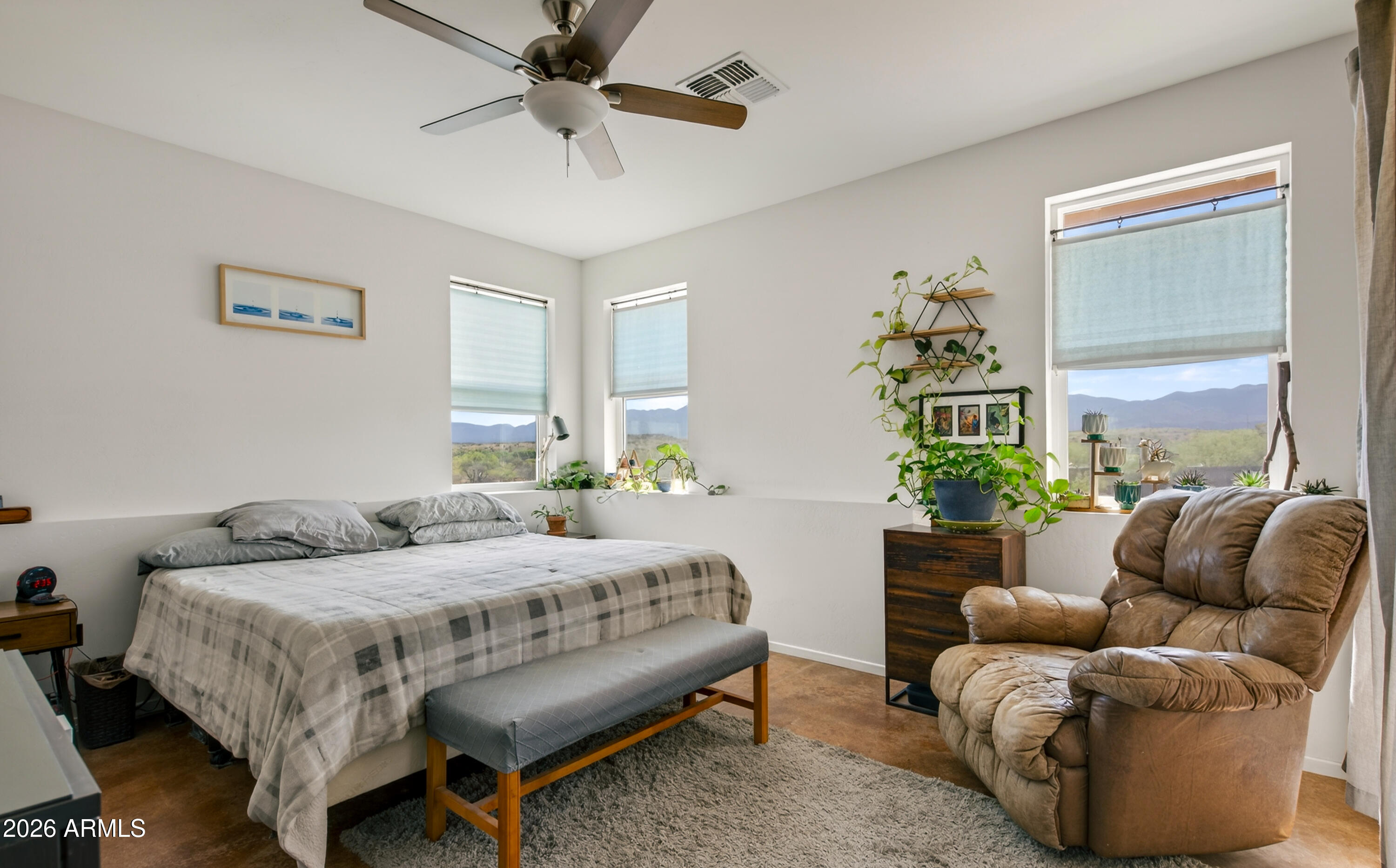 2771 South Country Hill Road Cornville, AZ 86325 - Photo 38 of 48 a bedroom with a bed couch and a window