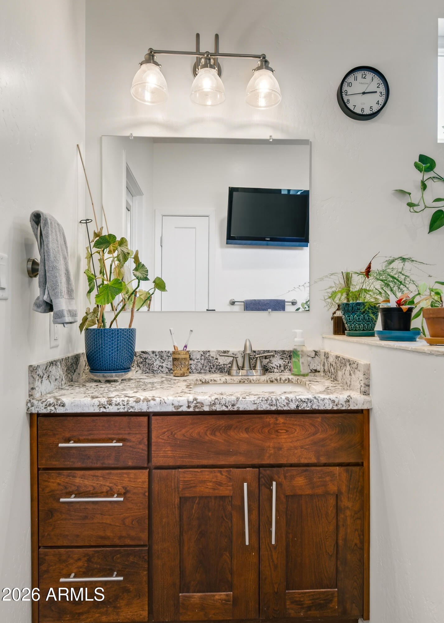 2771 South Country Hill Road Cornville, AZ 86325 - Photo 42 of 48 a bathroom with a granite countertop sink a faucet and a white wooden cabinets
