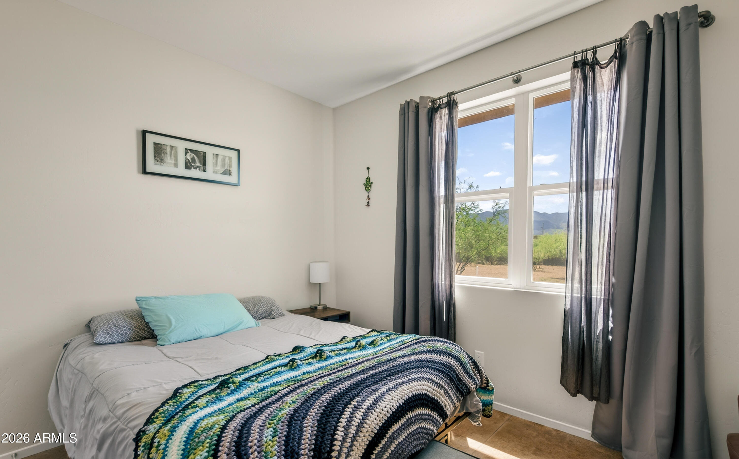 2771 South Country Hill Road Cornville, AZ 86325 - Photo 45 of 48 a bedroom with a bed and a window