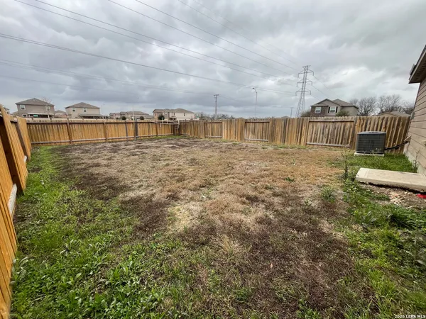 a view of a large yard with front of house